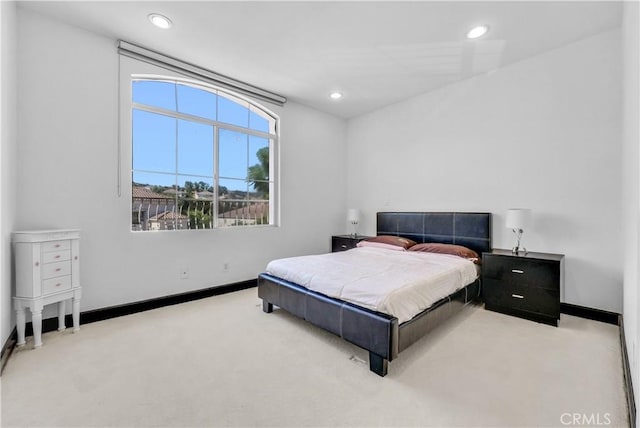 bedroom with light carpet