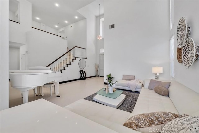 living room with a high ceiling