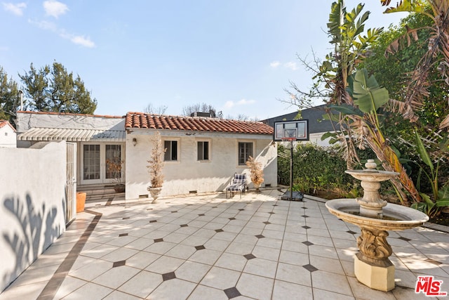 back of house featuring a patio area