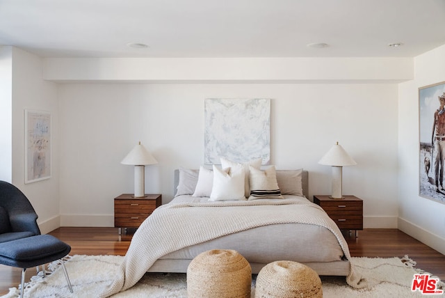 bedroom with hardwood / wood-style flooring