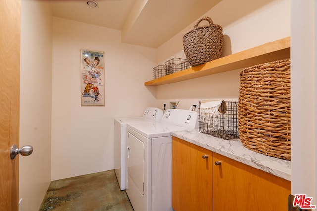 washroom featuring washer and dryer