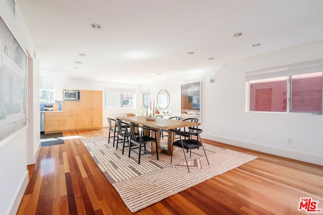 dining room with wood-type flooring