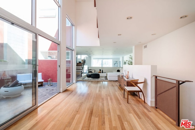 hall with light hardwood / wood-style floors