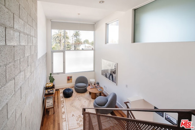 sitting room with hardwood / wood-style floors