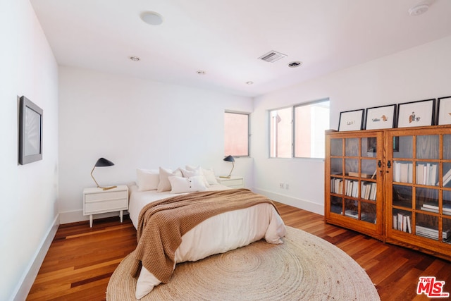 bedroom featuring wood-type flooring