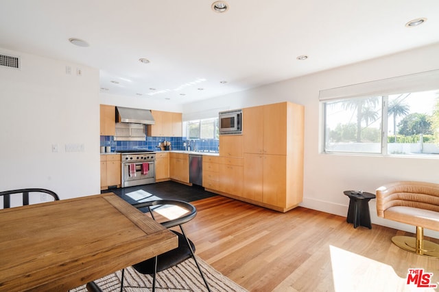 dining area with light wood-type flooring