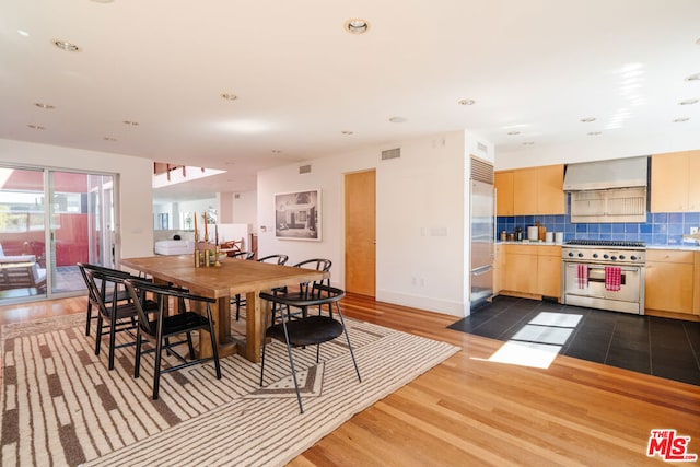 dining area with hardwood / wood-style flooring