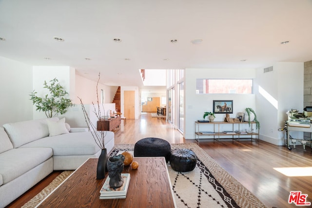 living room with light hardwood / wood-style floors