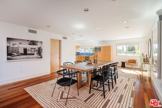 dining space featuring hardwood / wood-style floors