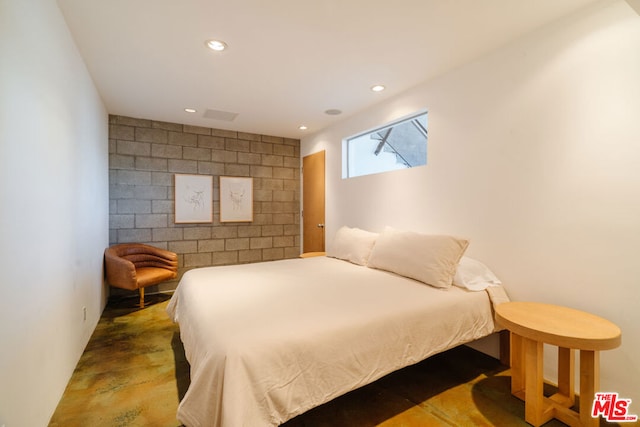 bedroom with concrete flooring