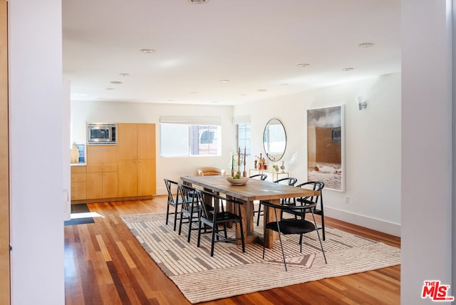 dining area with light hardwood / wood-style flooring