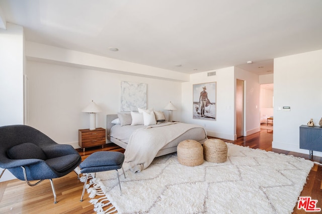 bedroom featuring hardwood / wood-style flooring