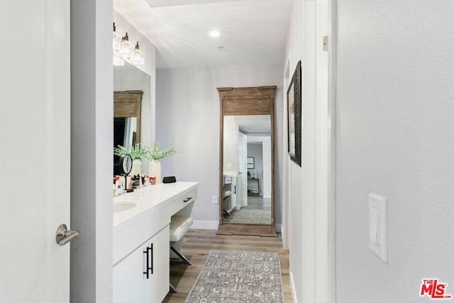 bathroom featuring vanity and hardwood / wood-style floors