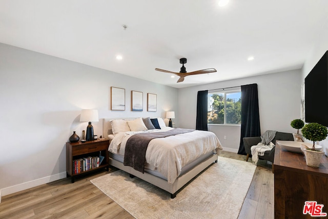 bedroom featuring ceiling fan and light wood-type flooring