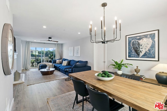 dining space with hardwood / wood-style flooring and ceiling fan