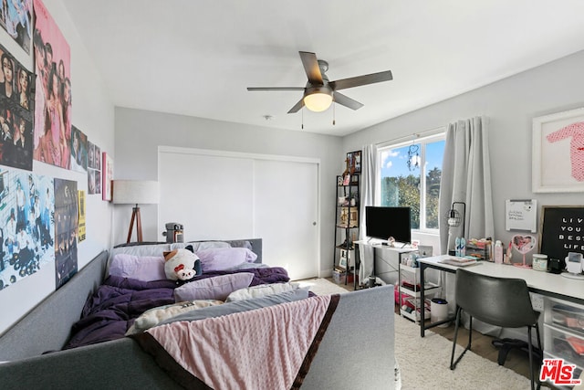 bedroom featuring a closet and ceiling fan