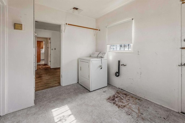 clothes washing area featuring washer / dryer