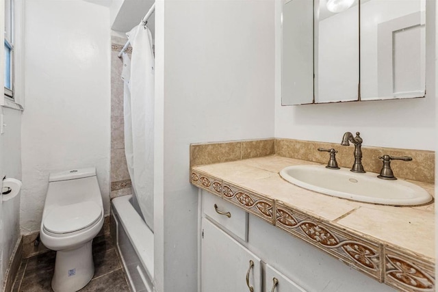 full bathroom featuring vanity, tile patterned floors, toilet, and shower / bath combo with shower curtain