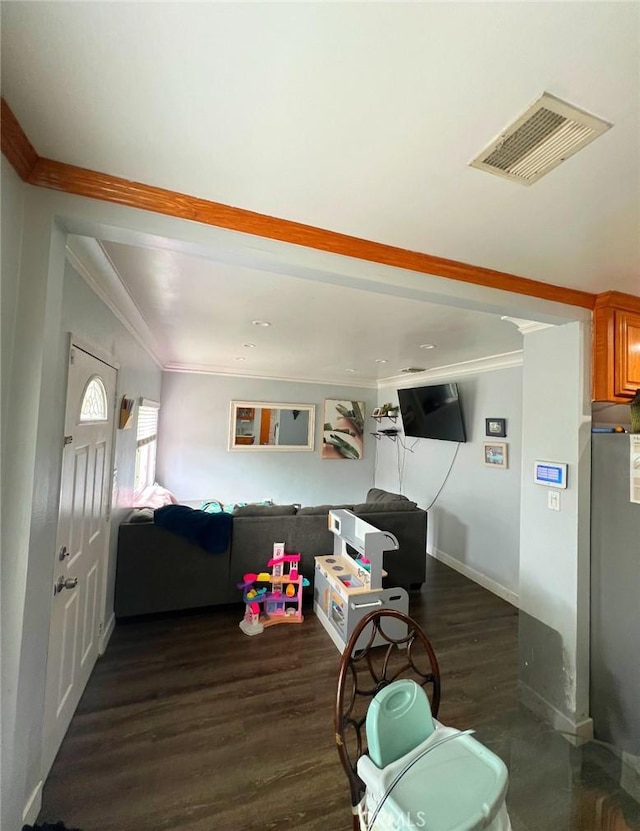 living room featuring crown molding and dark hardwood / wood-style floors