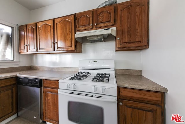 kitchen featuring white gas range and stainless steel dishwasher