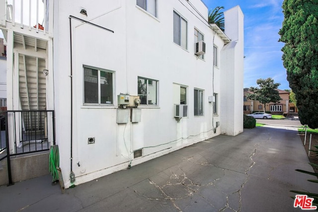 view of home's exterior with cooling unit