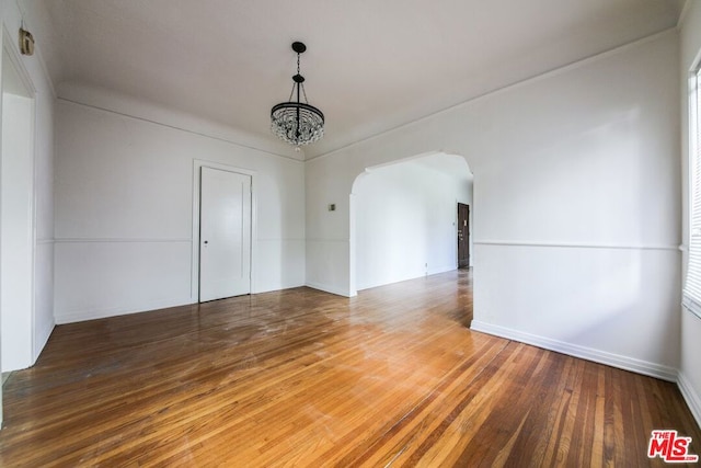 interior space featuring an inviting chandelier and wood-type flooring