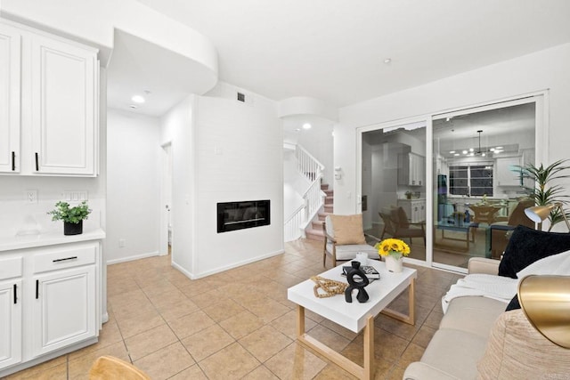 tiled living room with a large fireplace