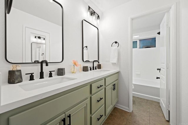 bathroom with vanity, shower / washtub combination, and tile patterned floors