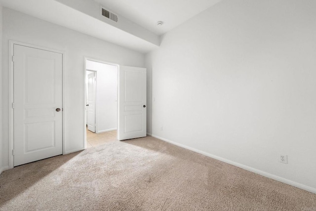 unfurnished bedroom with light carpet