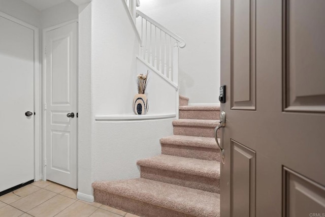 staircase with tile patterned flooring