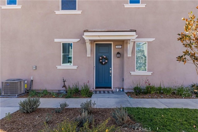 entrance to property with central AC unit