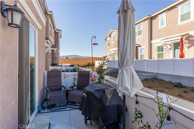 view of patio / terrace featuring a mountain view and area for grilling