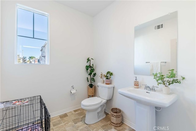 bathroom with sink and toilet