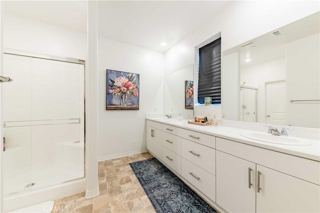 bathroom with an enclosed shower and vanity