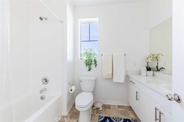 full bathroom with bathing tub / shower combination, vanity, and toilet