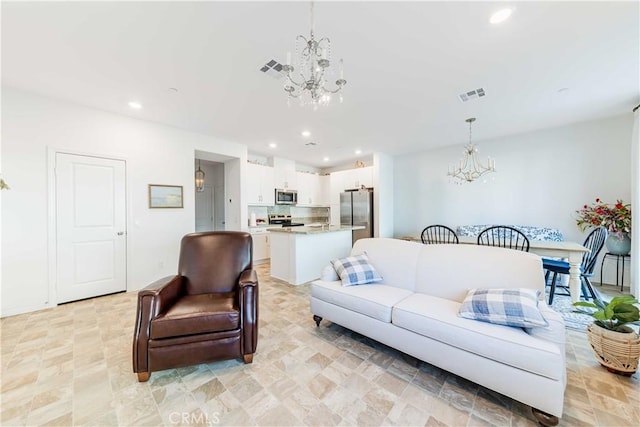 living room with a notable chandelier