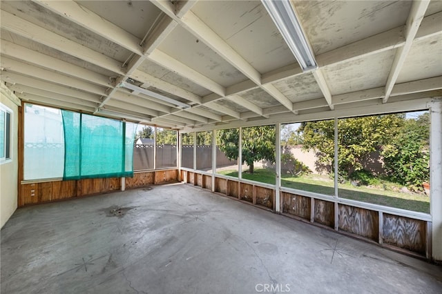 unfurnished sunroom with a wealth of natural light