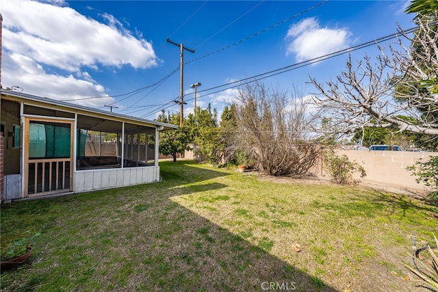 view of yard with a sunroom