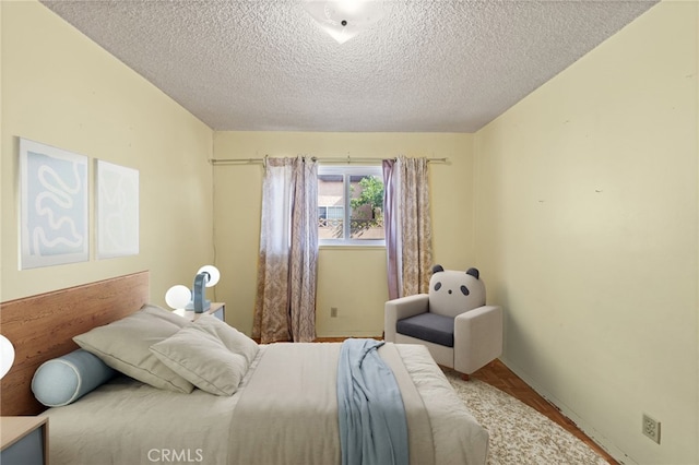 bedroom featuring a textured ceiling