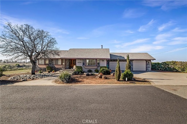 ranch-style home with a garage