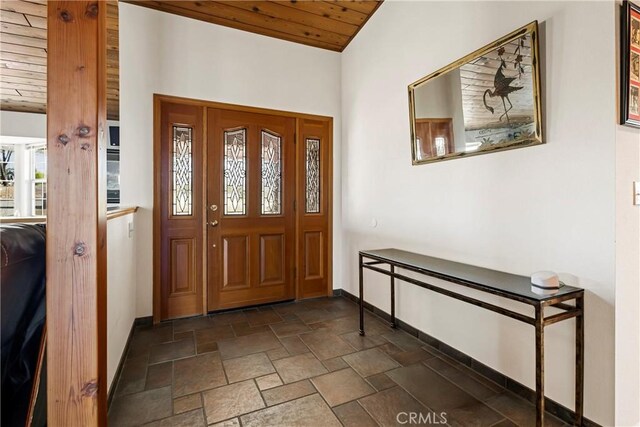 entryway featuring lofted ceiling and wood ceiling