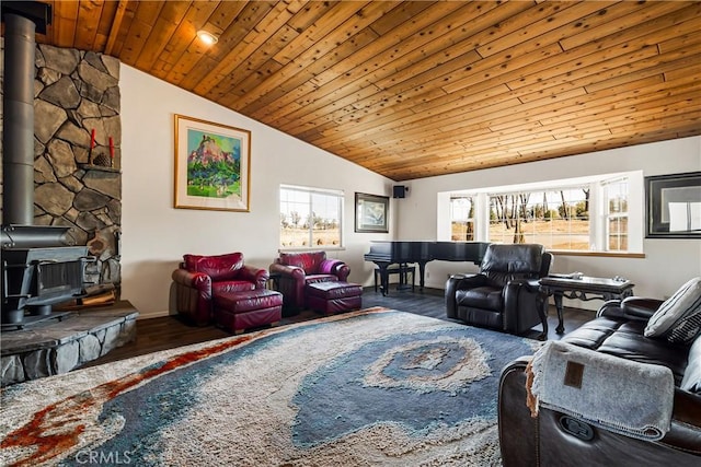 living room featuring hardwood / wood-style flooring, vaulted ceiling, wooden ceiling, and a wood stove