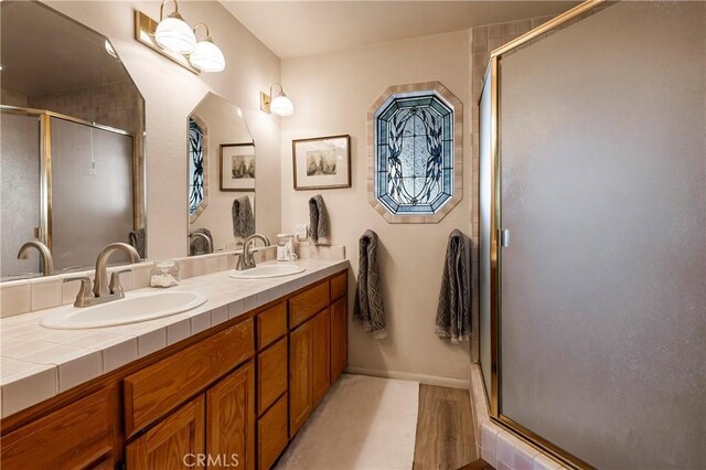 bathroom featuring vanity and walk in shower