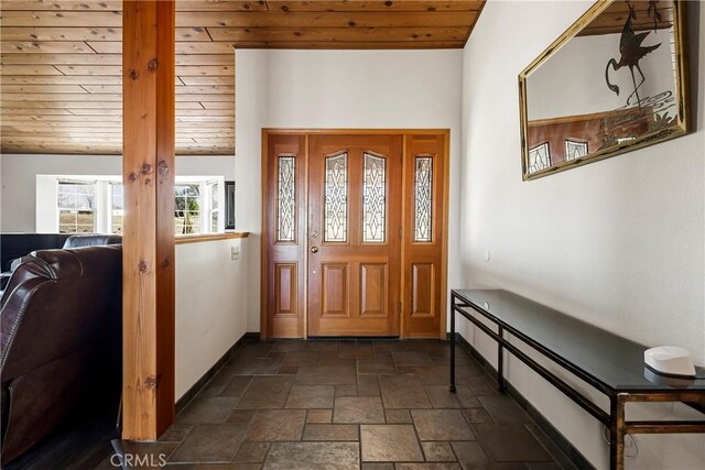 entrance foyer featuring vaulted ceiling and wood ceiling