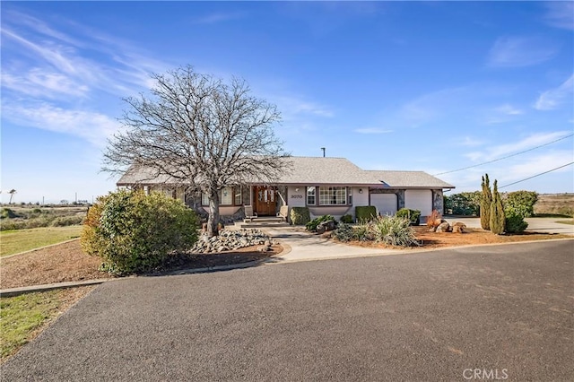 single story home with a garage