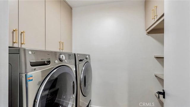 laundry room featuring cabinet space and independent washer and dryer