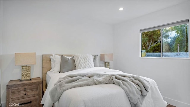 bedroom with recessed lighting and baseboards