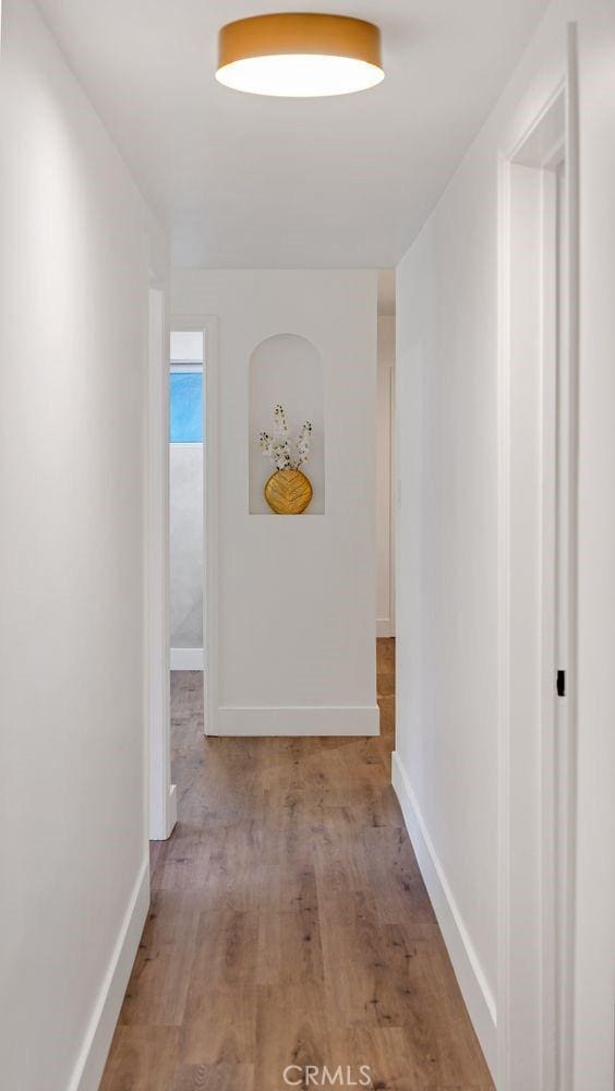 hallway featuring light hardwood / wood-style flooring