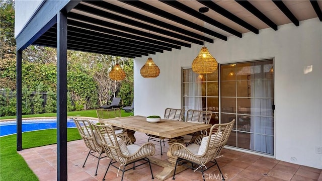 view of patio featuring outdoor dining area and an outdoor pool