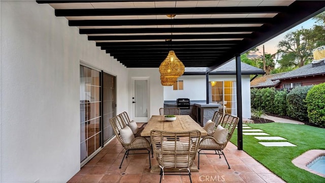 view of patio featuring area for grilling and outdoor dining space